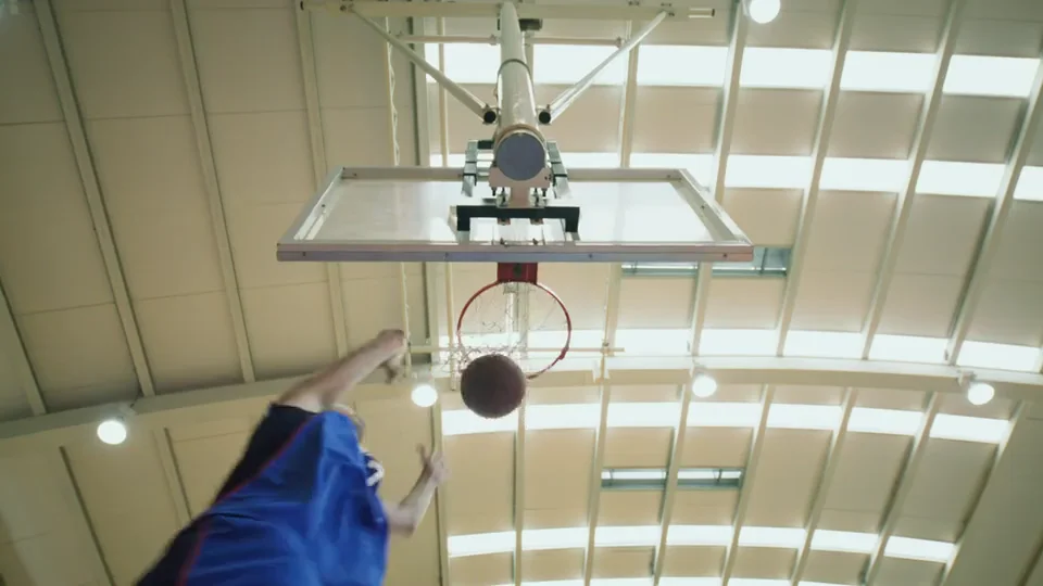 The same basketball practice footage, showing selected dunks, contested shots and driving layups